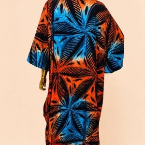 Vibrant African print kaftan with blue, orange, and black palm leaf design on a mannequin.